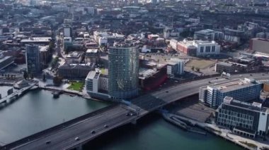 Aerial video of traffic driving through Belfast City Cityscape Northern Ireland 