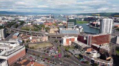 Aerial video of traffic driving through Belfast City Cityscape Northern Ireland 