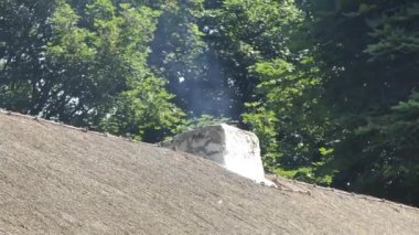 Chimney smoking from an old Irish Cottage