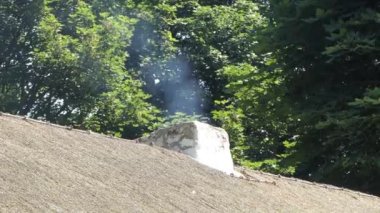 Chimney smoking from an old Irish Cottage