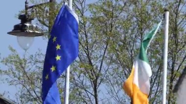 Irish National Flag Tricolour Flying by EU Flag Ireland.