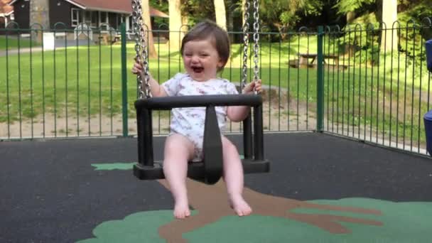 Small Girl Having Fun Swing Playpark — Video