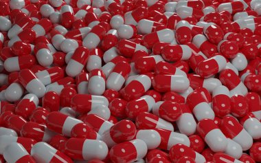 Beyaz arka planda kırmızı haplar ve kapsüller