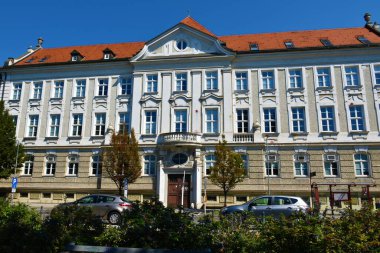 Maribor, Slovenia - July 31 2022: Building in the town of Maribor, Stajerska, Slovenia and a bus stop with Krekova - municipality written on it