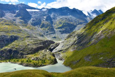 View of mountains Schwerteck and Schwertkopf in Glockner group of the High Tauern mountain range in Carinthia, Austria and Stausee Margaritze bellow