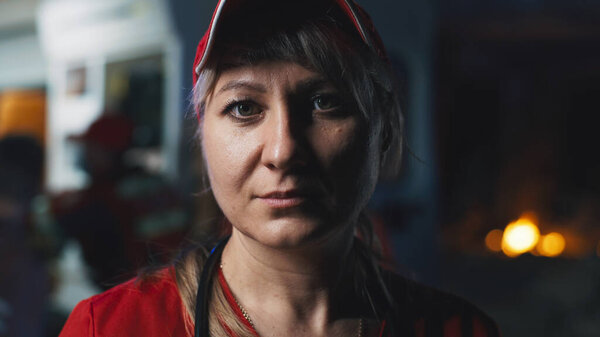 Female paramedic looking at camera