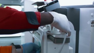 Crop doctors using defibrillator on patient