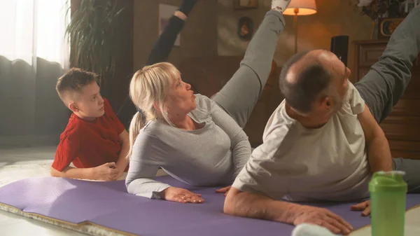 Grandparents and grandson exercising together — Stock Photo, Image