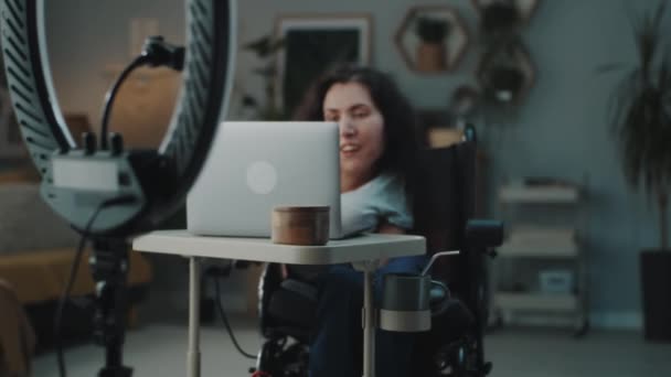 Happy Woman Wheelchair Sitting Table Editing Video Her Blog Laptop — Αρχείο Βίντεο