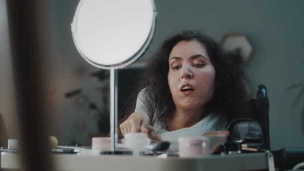 Woman Spinal Muscular Atrophy Wheelchair Applying Eyeshadow Using Brush Looking — Αρχείο Βίντεο