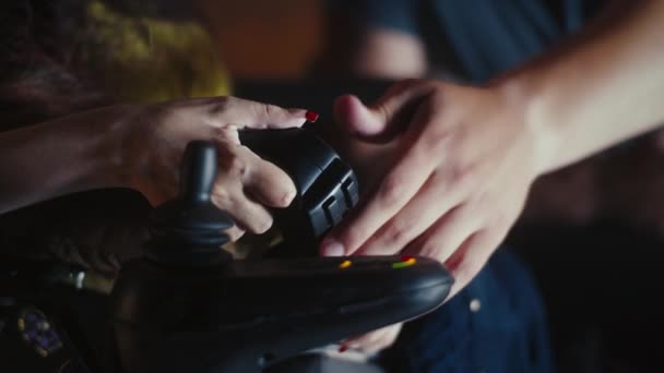 Unrecognizable Man Helping Woman Disability Motorized Wheelchair Gamepad She Starting — Video Stock
