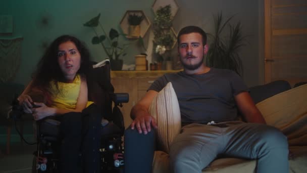 Woman Disability Wheelchair Man Surprising Rejoicing While Looking Watching Movie — Stok video