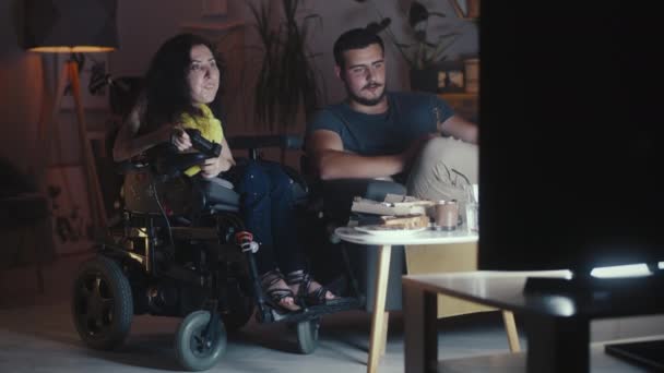Woman Disability Wheelchair Playing Video Game Console Using Gamepad Together — Stock Video