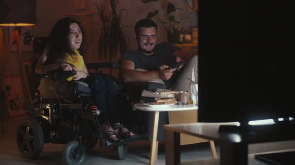 Man Playing Video Game Console Using Gamepad Woman Physical Disability — Stock Video