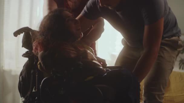 Family Taking Care Woman Spinal Muscular Atrophy Helping Her Sit — Video