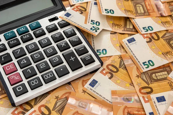 business and exchange concept with euro cash and calculator. economy