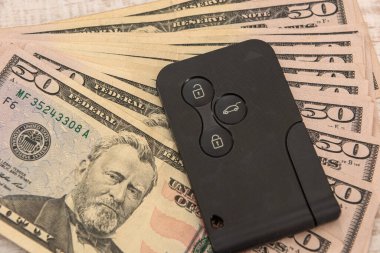 Modern araba anahtarı ile dolar, satış ya da kira konsepti