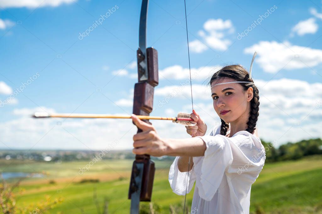 fictional Native American Indian  woman with a bow and arrows. lifestyle