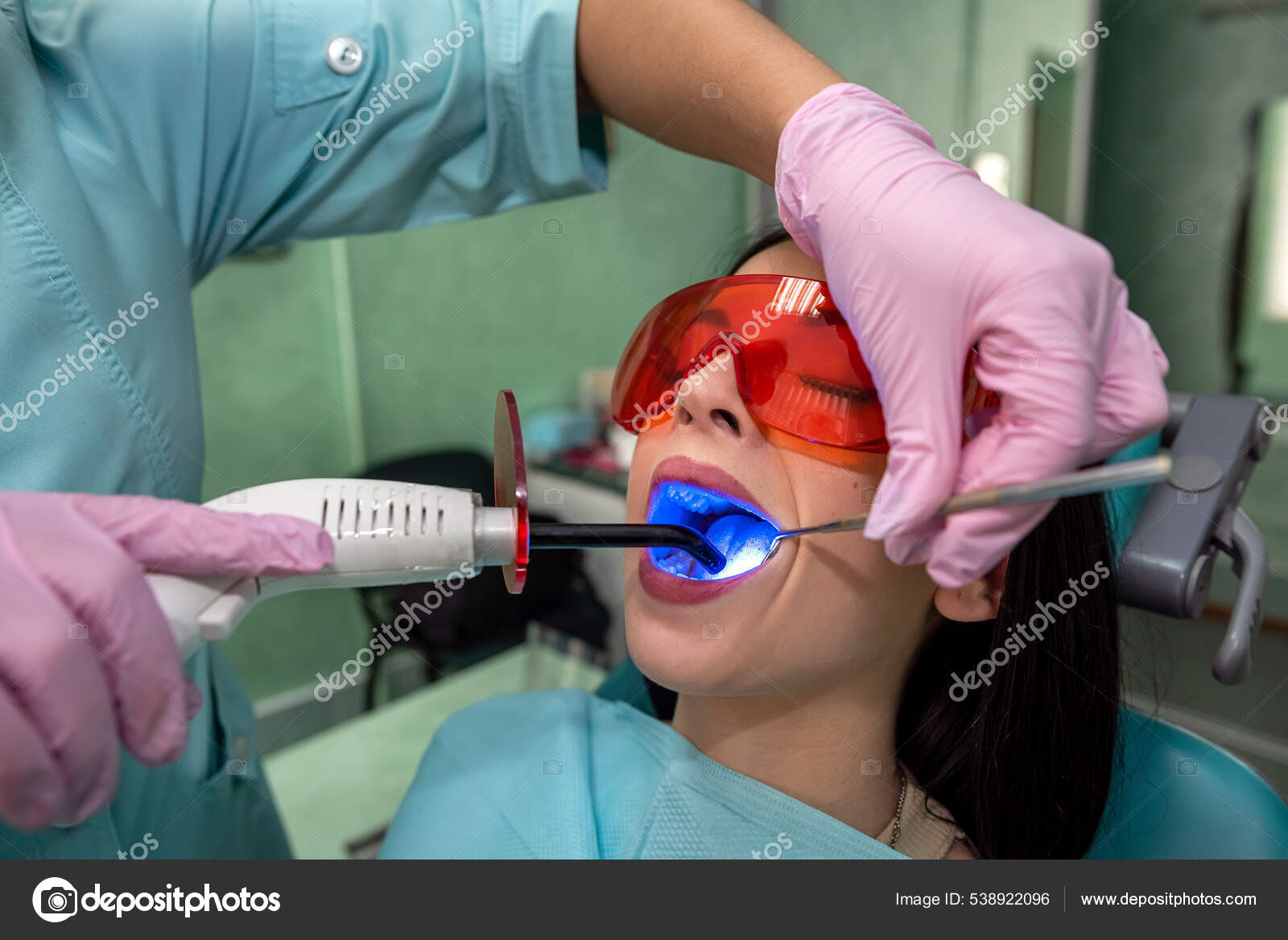Woman Dentistry Making Whitening Procedure Stomatologist Stock Photo by