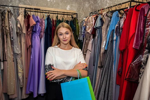 Beautiful Woman Choosing Evening Dress Rent Garment Supermarket — стоковое фото