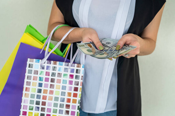 woman cound dollar after shoping crazy black friday. discount concept