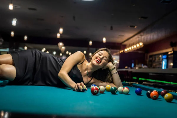 Sexy Female Pool Player Wear Black Dress Lying Billiard Table — Stockfoto