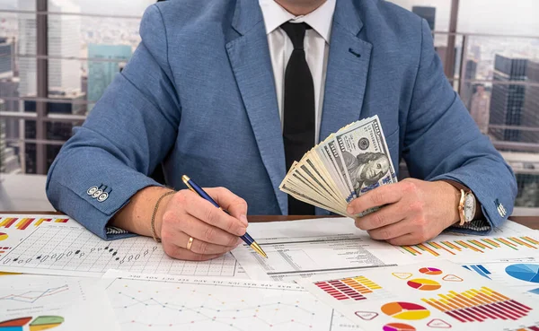 Stylishly Dressed Businessman Tie Looks Profit Graphs Calculates Expenses Dollars — Stock Photo, Image