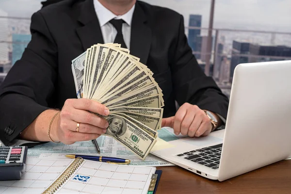 Young Stylish Businessman Counts Large Sum Dollars Fills Out Tax — Stock Photo, Image