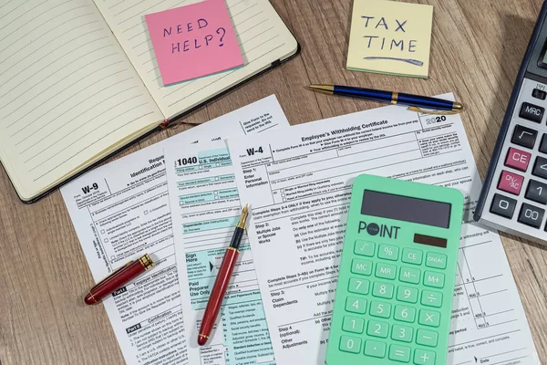 many us tax form 1040 w4 w9 on office desk. financial documents. Financial concept. Tax time.