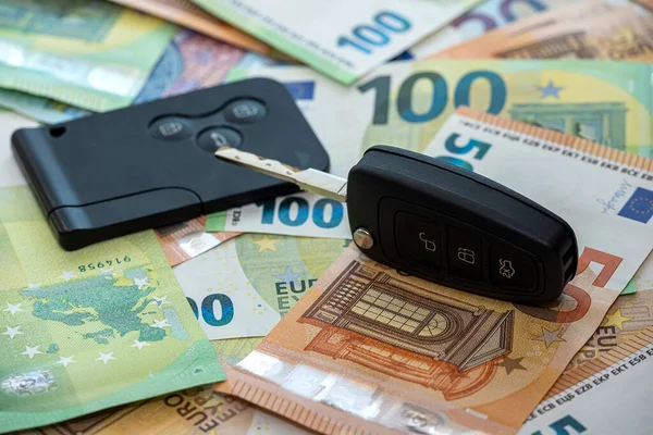 black car key on euro money, insurance or rent car. Sales concept