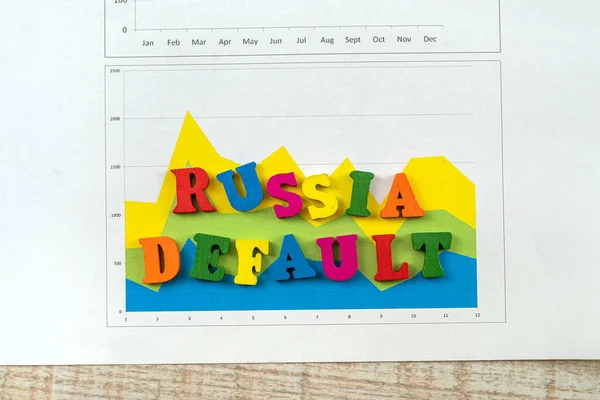 Russian default text in color cubes on business finance document. The collapse of the ruble