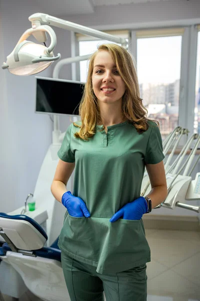 young female dentist in private clinic with modern dental equipment. health care