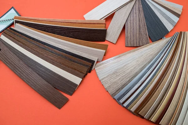 Wooden parquet floor sample interior material  isolated on orange background. copy space