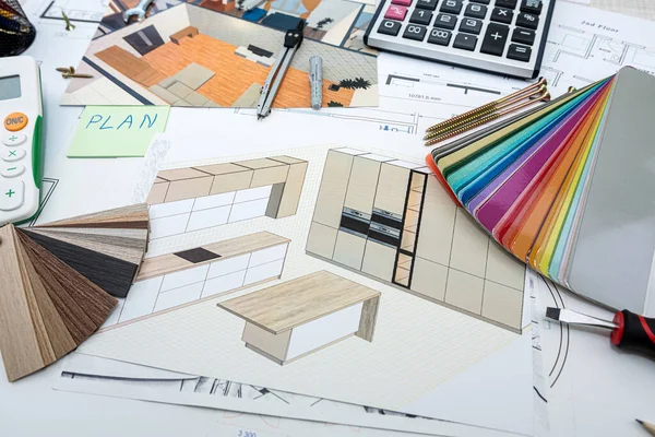 Drawings and plans for house decoration with tools color sampler for repair on desk