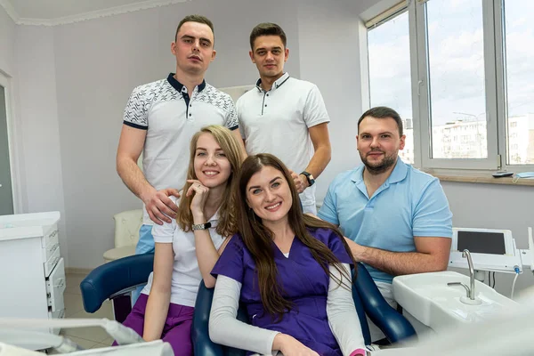 beautiful young people experienced in medicine who love to treat teeth posing for a portrait. Concept of happy dentists on portrait