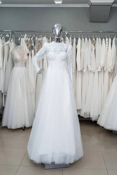 boutique wedding dress on mannequin in bridal store. Fashion concept