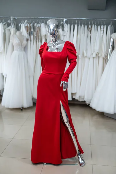 elegant red dress on a mannequin in a modern salon