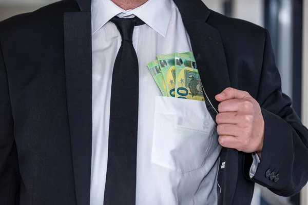 man in suit with good taste holds euro banknotes for big purchase. Big purchase concept