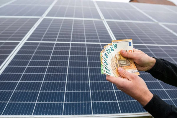 after the installation of economical solar panels, the owner of the project pays in euros. The concept of green energy saving