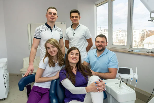 beautiful young people experienced in medicine who love to treat teeth posing for a portrait. Concept of happy dentists on portrait