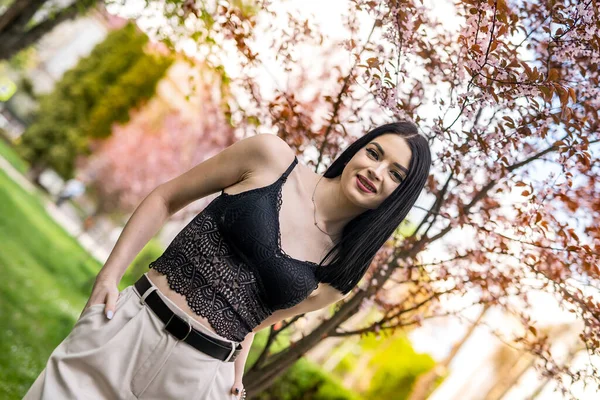 Stylish Young Woman White Leather Jacket Posing Cherry Blossom Spring — Zdjęcie stockowe