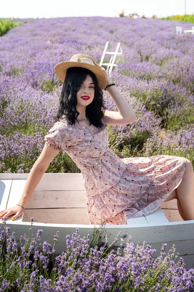 Young Brunette Straw Hat Sits Background Lavender White Polka Dot —  Fotos de Stock