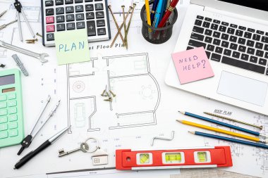 Top view of a drawing of the architects of a modern house with a sample of material on a creative table. Design concept