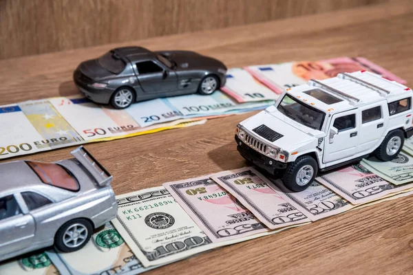 toy cars on money road