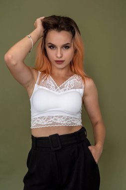 beautiful woman with luxurious hair in a classic dress on a beautiful background. Shooting concept for girls