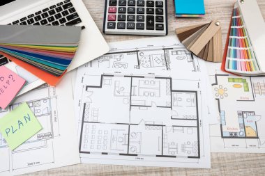 Drawings and plans for house decoration with tools color sampler for repair on desk
