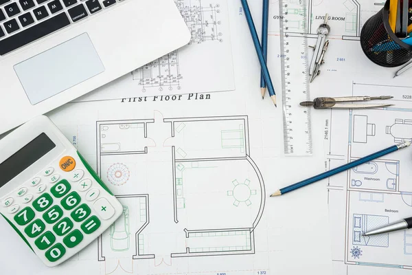Top view of a drawing of the architects of a modern house with a sample of material on a creative table. Design concept