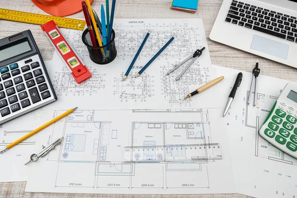 Top view of a drawing of the architects of a modern house with a sample of material on a creative table. Design concept