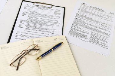 Tax Form 1040 per tax year for individual U.S. tax returns with a pen next to it. The concept of tax forms