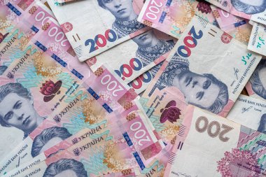 top view about a lot of Ukrainian hryvnia on the table. The concept of wealth and earnings
